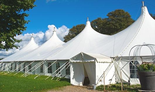 a row of portable restrooms placed outdoors for attendees of a special event in Boggstown IN