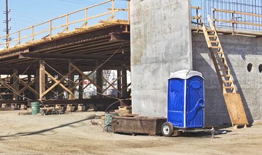 easily accessible porta potties at a work site, saving workers from long walks to a permanent restroom